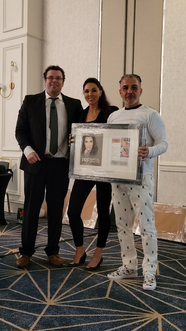 Dr. Panahpour receiving the PRF in Facial Esthetics award
